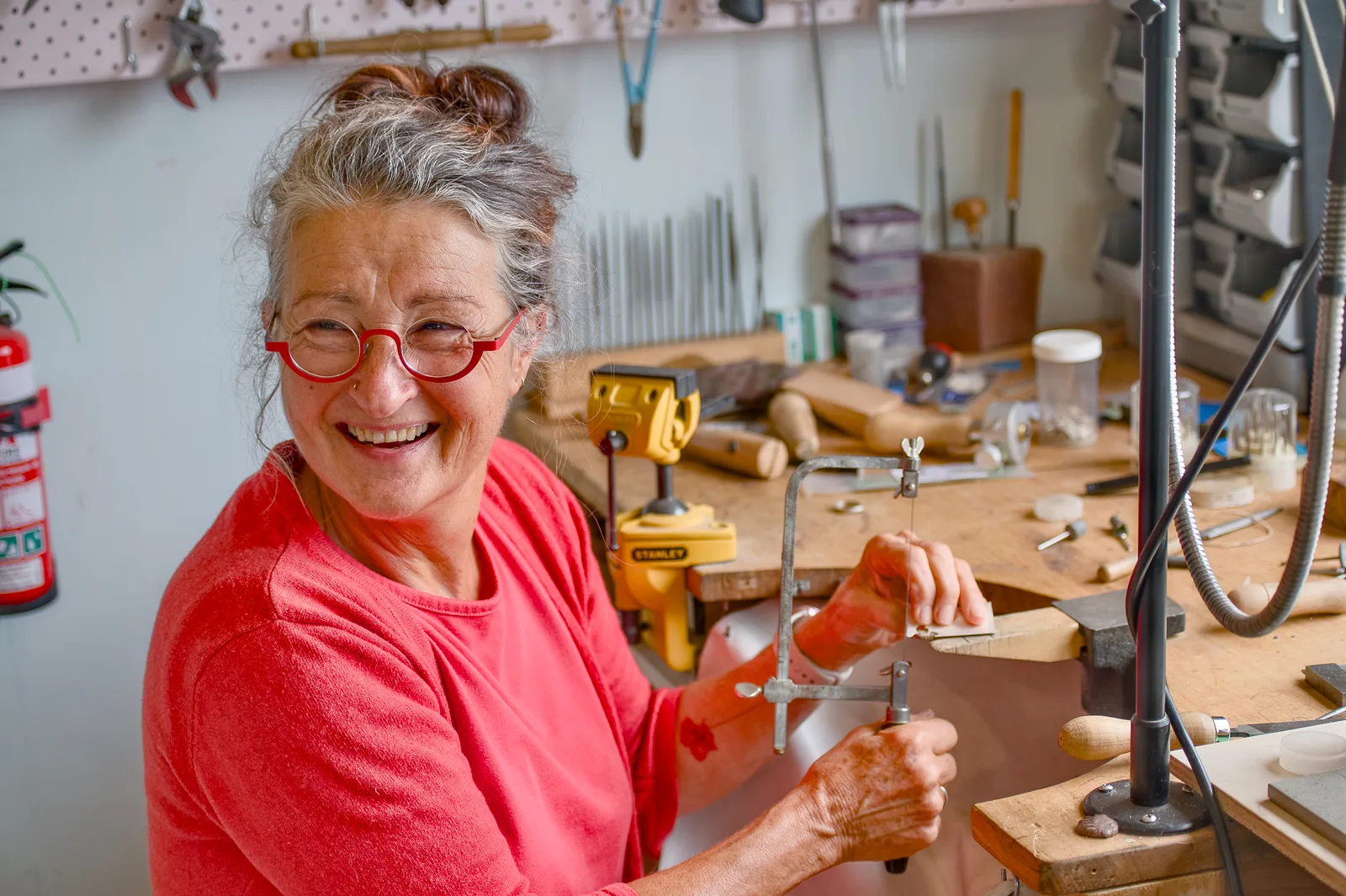 Sue Plumb at her bench in Blue Range Studio